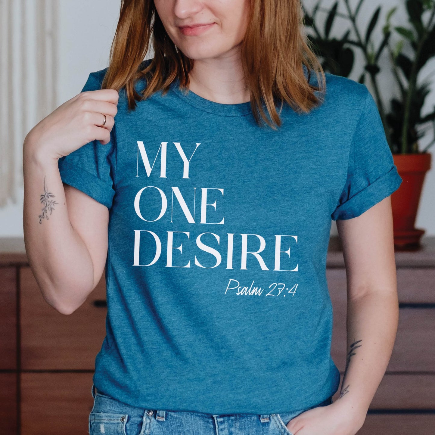 Woman wearing a "My One Desire Psalm 27:4" bible verse Heather Deep Teal unisex Christian t-shirt designed for spirit-filled men and women