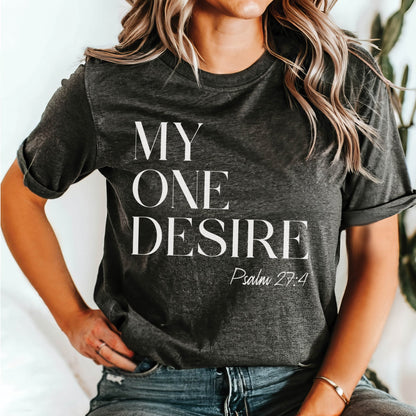 Trendy young woman wearing a "My One Desire - Psalm 27:4" bible verse heather dark gray Bella Canvas 3001 unisex Christian t-shirt for those who seek after God