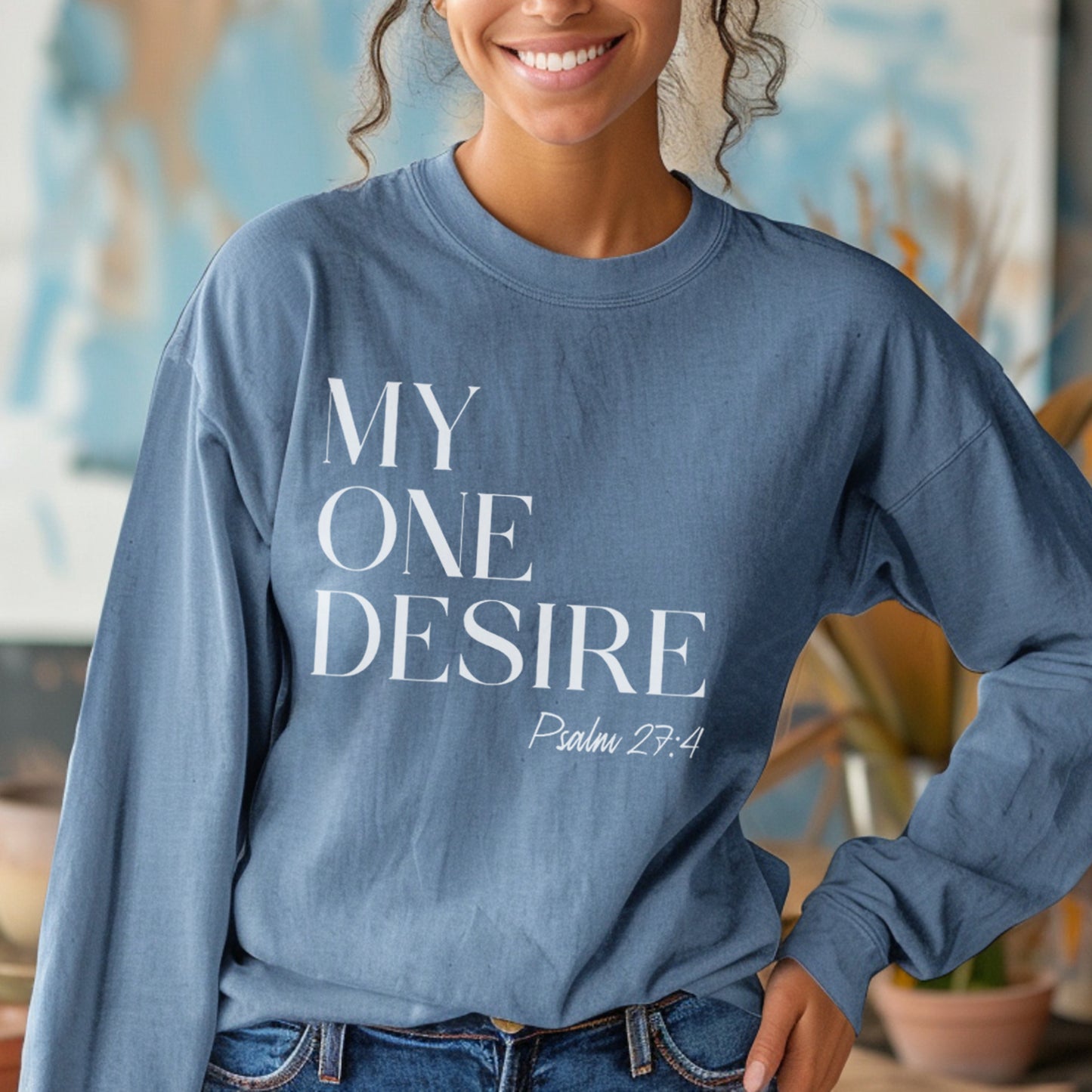 Indigo blue cozy soft long sleeve Christian unisex t-shirt with simple modern My One Desire Psalm 27:4 bible verse message printed on front side in white text, designed for both men and women 