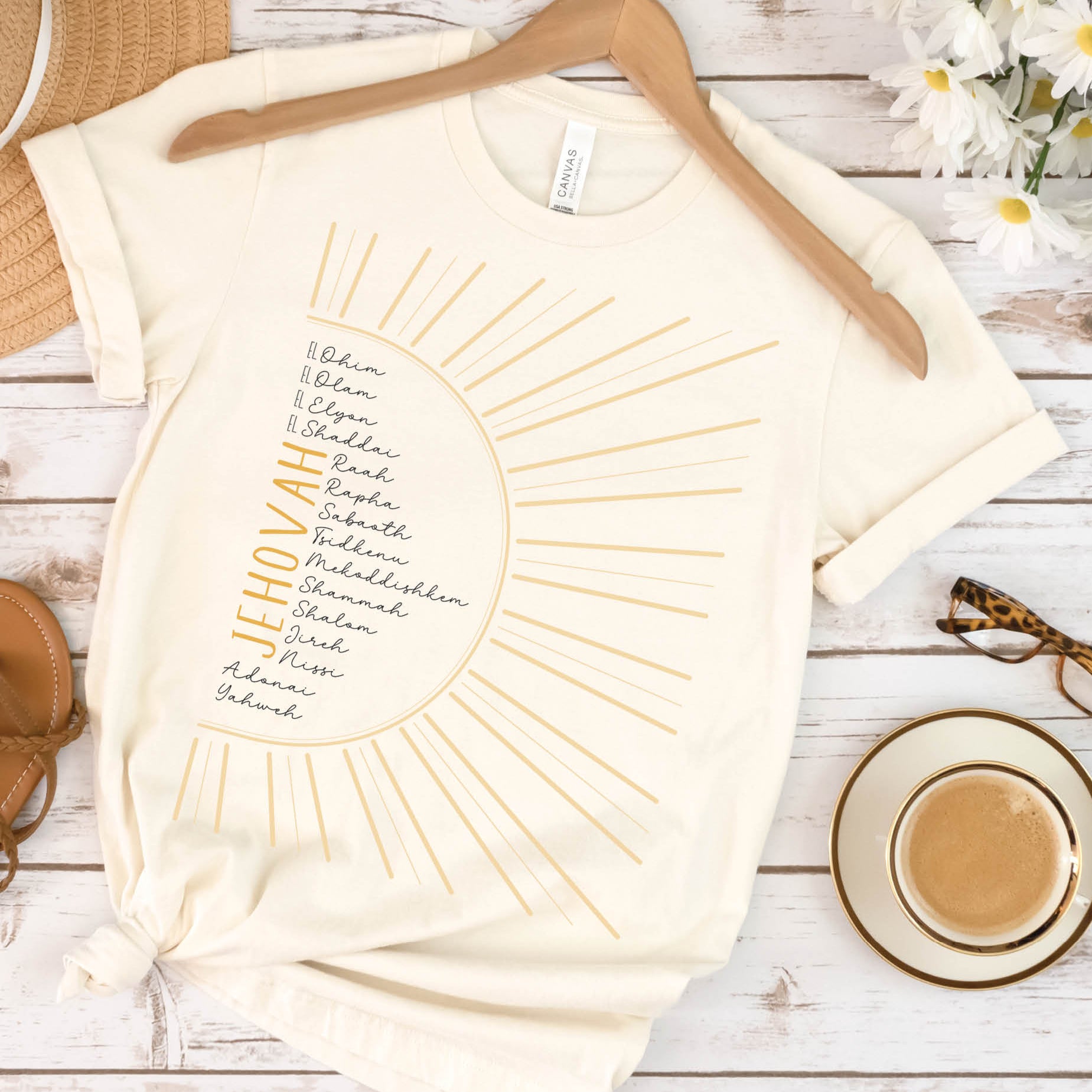 The Names of God Hebrew Christian Old Testament Bible List Sunshine T-Shirt, printed in gold and black on soft cream Bella-Canvas 3001 t-shirt, women's soft unisex fit regular and plus size tee