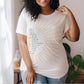 Beautiful black woman wearing The Names of God Hebrew Christian Old Testament Bible List Sunshine T-Shirt, printed in gold and white on White Bella-Canvas 3001 t-shirt, women's unisex fit regular and plus size tee