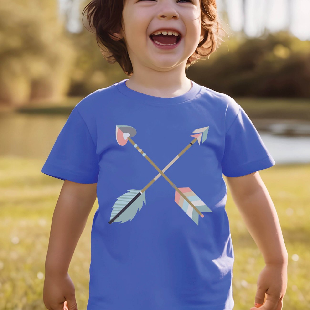 Cute toddler boy wearing a heather Columbia blue kids Christian t-shirt with pastel boho criss-cross arrows for matching mommy-and-me Psalm 127:3-5 Raising a Quiver Full of Arrows bible verse women's tee