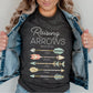 Christian mom young woman wearing a dark heather gray t-shirt with 'Raising Arrows' Psalm 127:3-5 design with 5 personalized names under each arrow on a white background