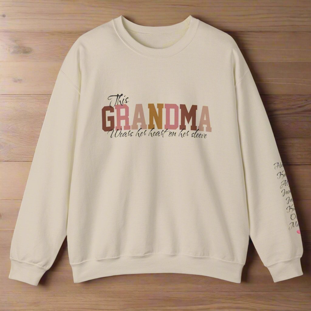 Personalized This GRANDMA Wears Her Heart On Her Sleeve Grandchildren names sleeve print soft sand color cozy trendy women's sweatshirt gift for Christmas, birthday or Mother's day