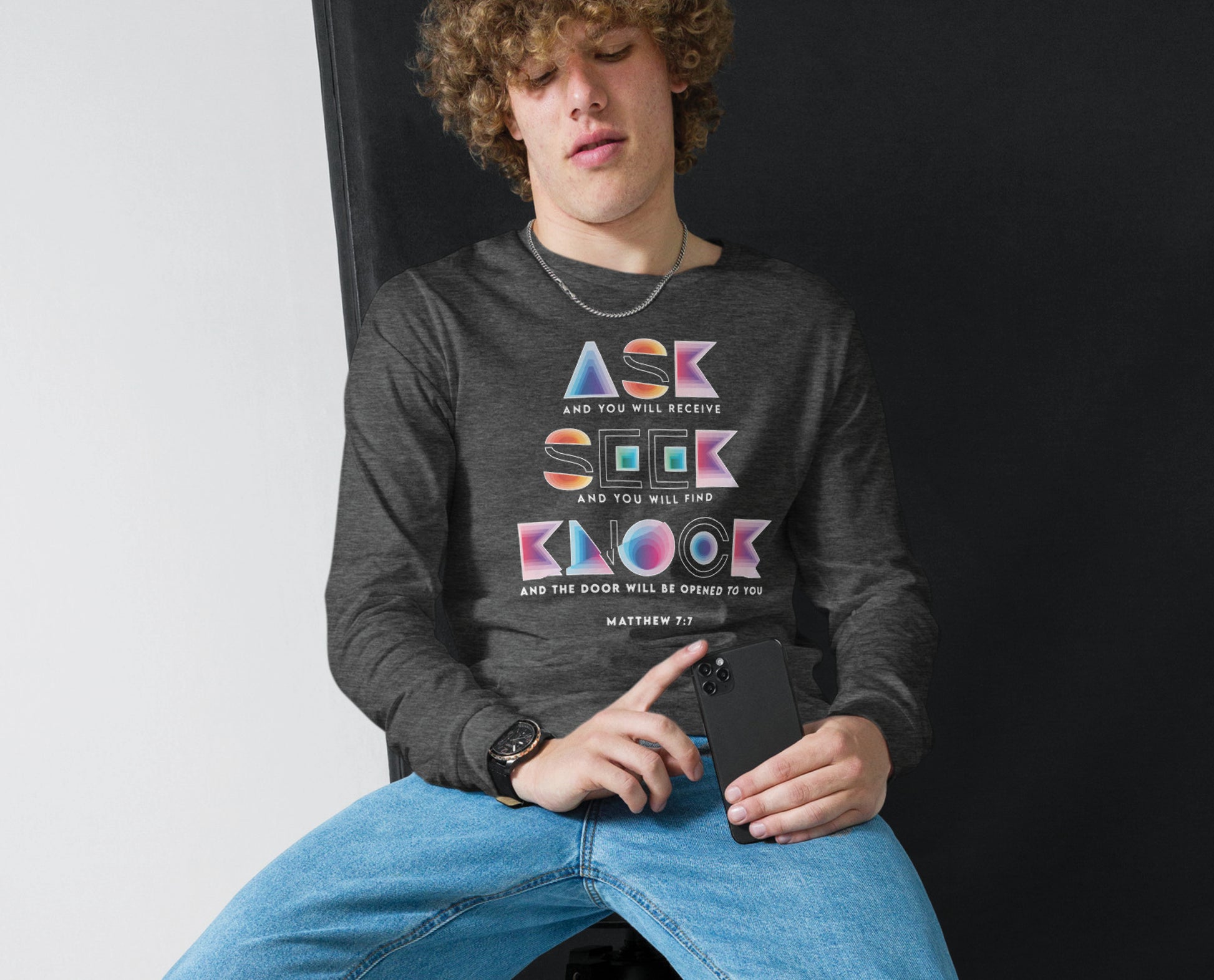 Ask Seek Knock Matthew 7:7 Christian aesthetic design printed in holographic colors on heather dark gray soft long sleeve tee for men & women