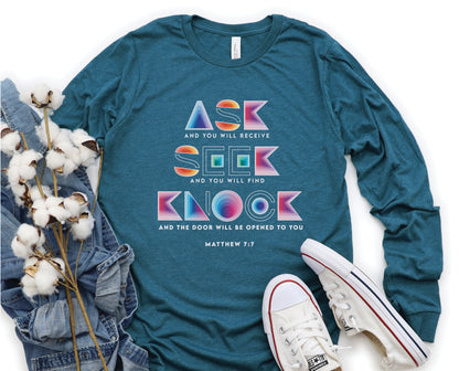Ask Seek Knock Matthew 7:7 Christian aesthetic design printed in holographic colors on heather deep teal soft long sleeve tee for men & women