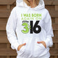 Stylish young woman wearing a white Unisex Cozy Hoodie with Christian aesthetic bible verse message that says, "I Was Born Again On John 3:16" bible verse quote in lime green and white for men and women