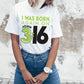 Young trendy woman wearing a White Christian aesthetic unisex t-shirt with a play on words that says, I Was Born Again on John 3:16, bible verse scripture quote in lime green and black, designed for men and women