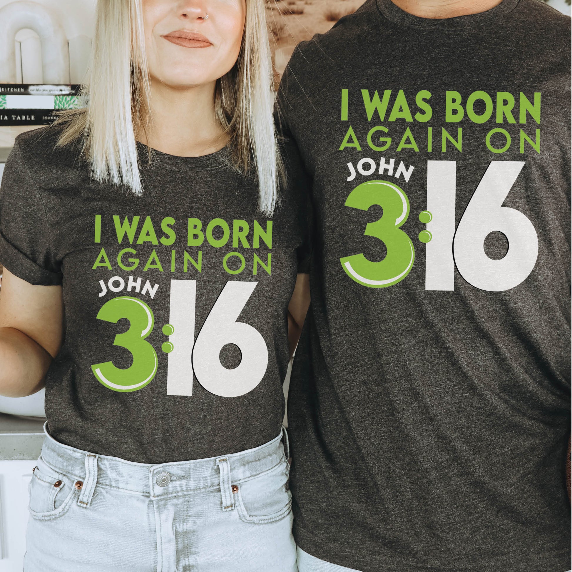 Young trendy guy and woman wearing Heather Dark Gray Christian aesthetic unisex t-shirt with a play on words that says, I Was Born Again on John 3:16, bible verse scripture quote in lime green and black, designed for men and women