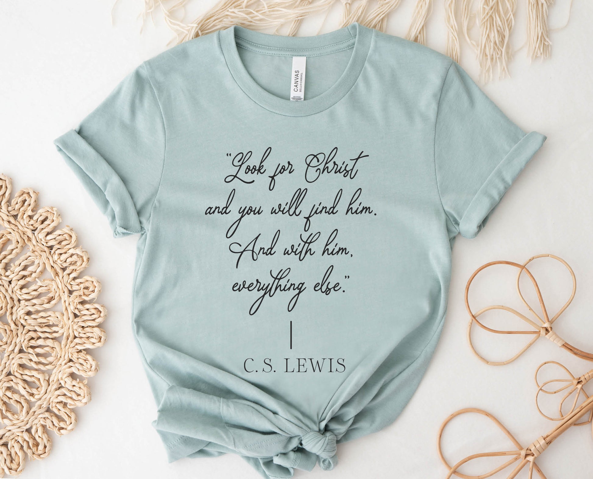 Soft quality heather dusty blue t-shirt with British writer Narnia author C.S. Lewis quote "Look for Christ and you will find him. And with him, everything else."  printed in black vintage script - Christian aesthetic unisex tee shirt design for women