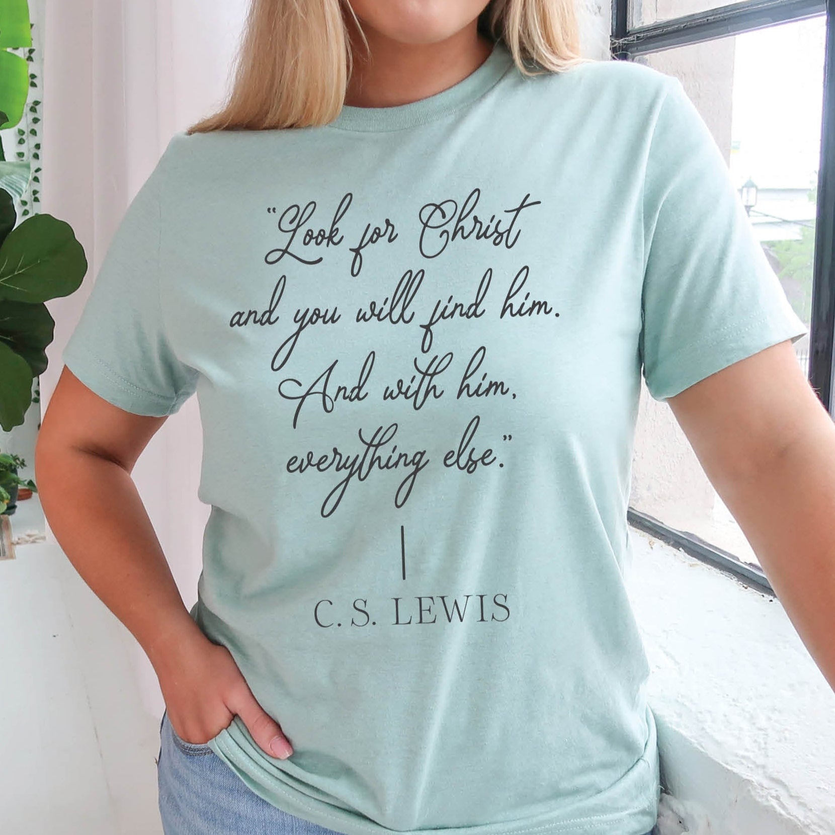 Soft quality heather dusty blue t-shirt with British writer Narnia author C.S. Lewis quote "Look for Christ and you will find him. And with him, everything else."  printed in black vintage script - Christian aesthetic unisex tee shirt design for women