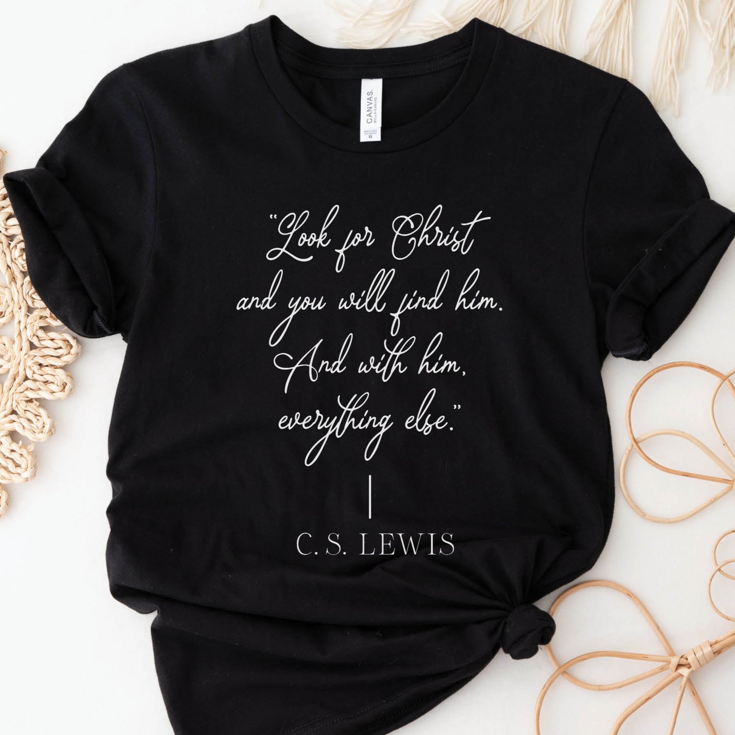 Soft quality black t-shirt with British writer Narnia author C.S. Lewis quote "Look for Christ and you will find him. And with him, everything else."  printed in white vintage script - Christian aesthetic unisex tee shirt design for women