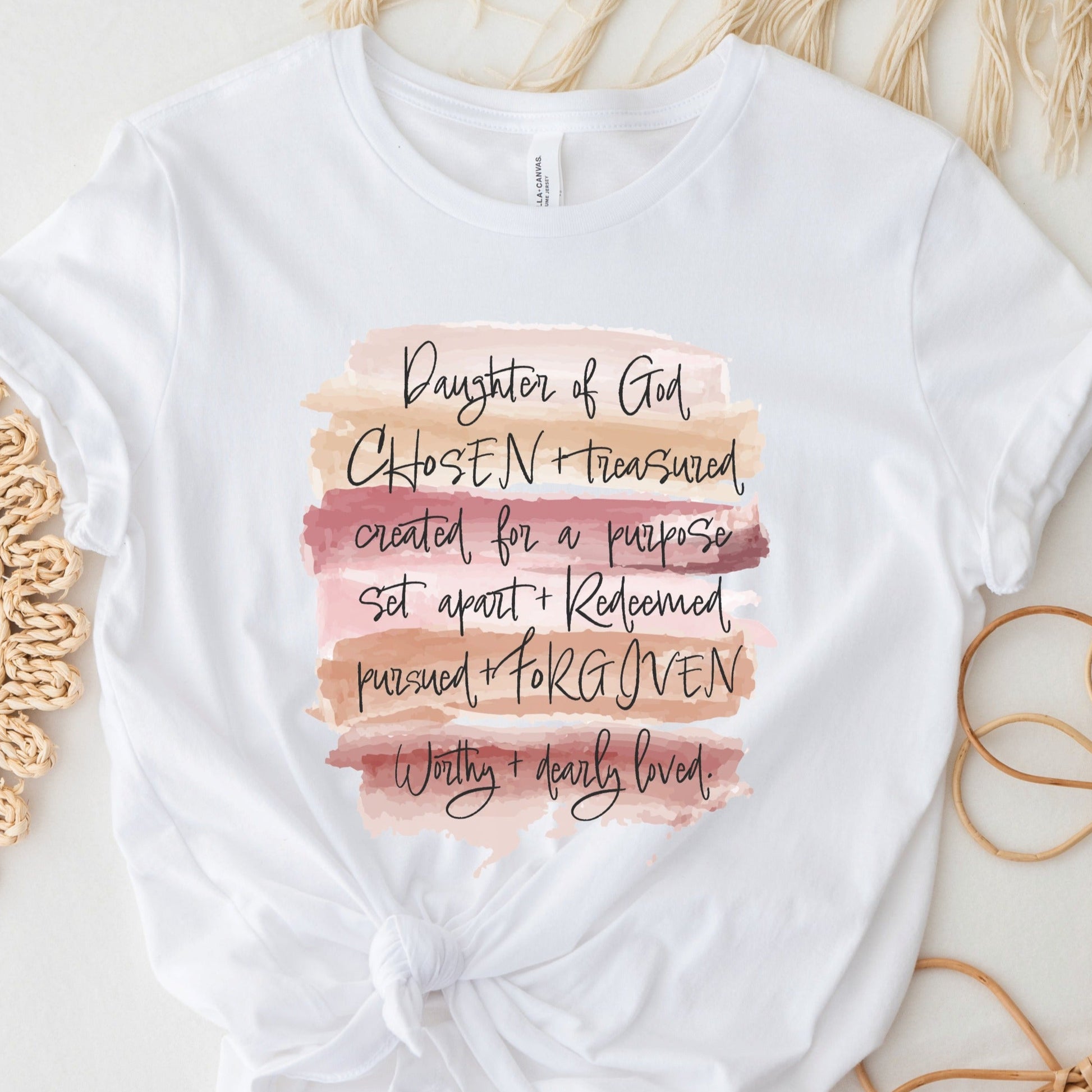 Daughter of God, Chosen, created for a purpose, redeemed, forgiven, worthy, loved, Christian woman aesthetic with watercolor splash background printed on soft white unisex t-shirt for women