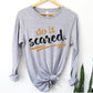 Do It Scared faith over fear 2 Timothy 1:7 do not fear bible verse Christian aesthetic design printed in black and gold on soft heather gray unisex long sleeve tee shirt for women and men