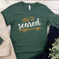 Do It Scared faith over fear 2 Timothy 1:7 do not fear bible verse Christian aesthetic design printed in white and gold on soft heather forest green unisex long sleeve tee shirt for women and men
