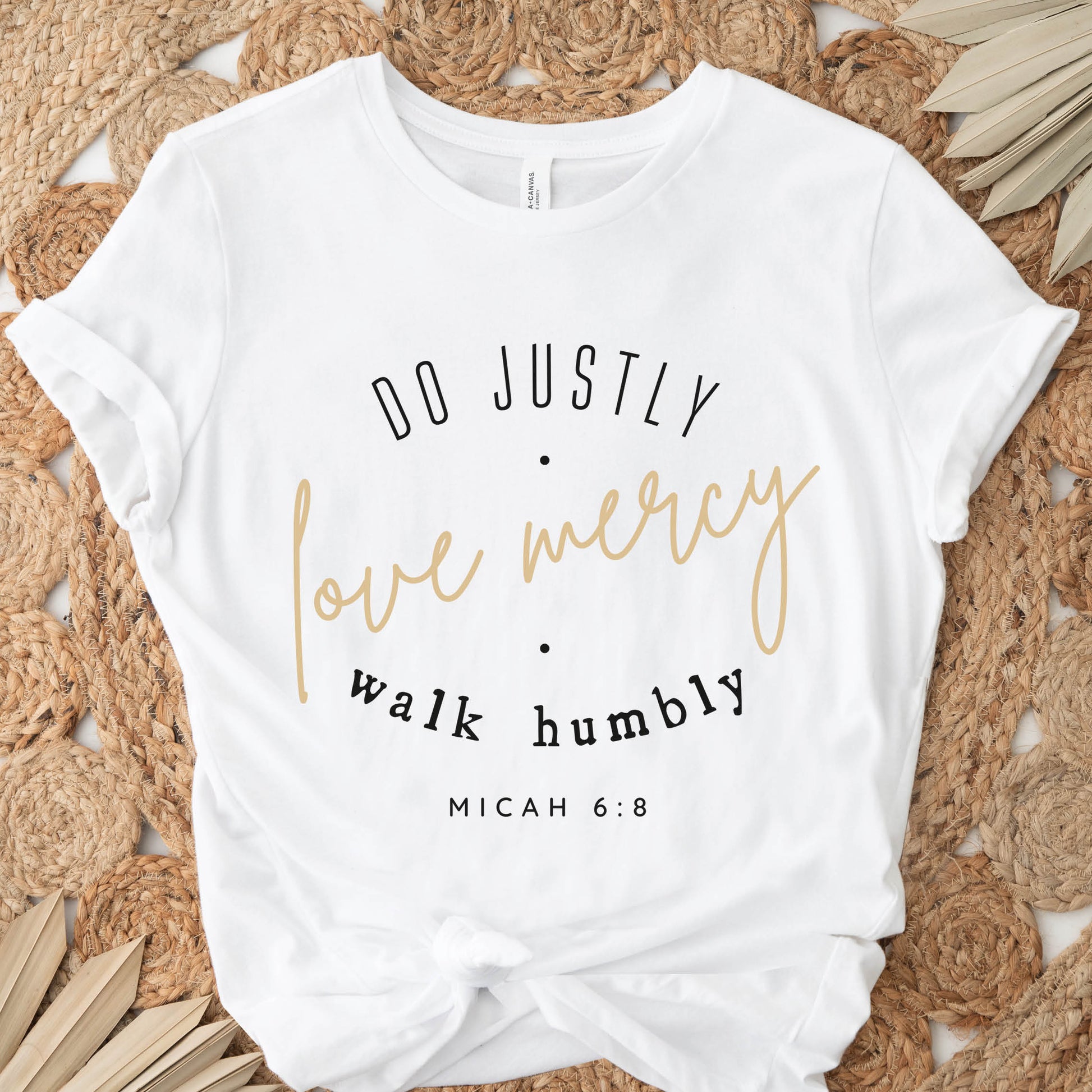 White Christian aesthetic faith-based unisex t-shirt for women with Micah 6:8 bible verse scripture printed that says, Do Justly Love Mercy walk humbly, in gold and black, unique gift for her