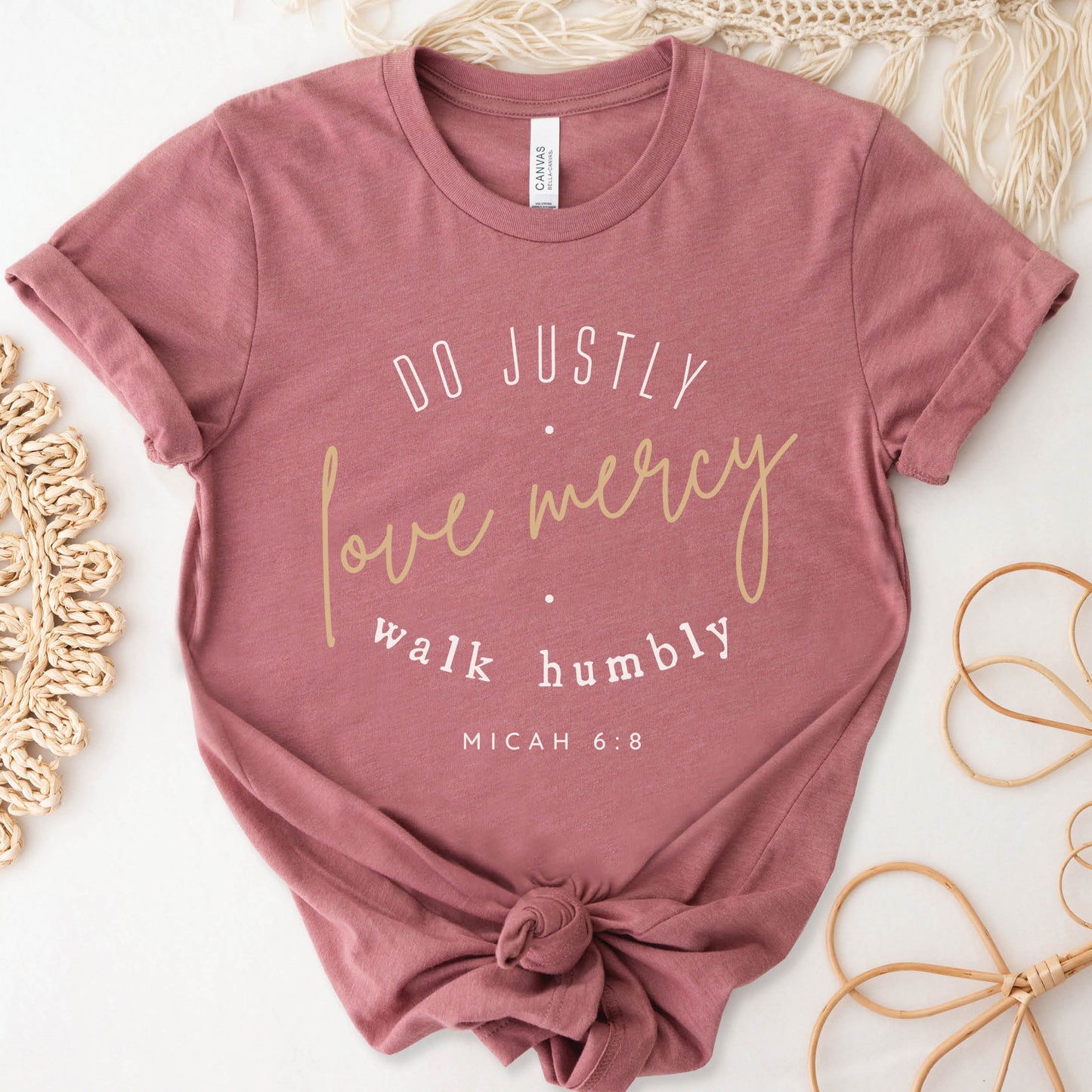 Mauve Dusty Pink Christian aesthetic faith-based unisex t-shirt for women with Micah 6:8 bible verse scripture printed that says, Do Justly Love Mercy walk humbly in gold and white, designed for women in sizes small thru 4X