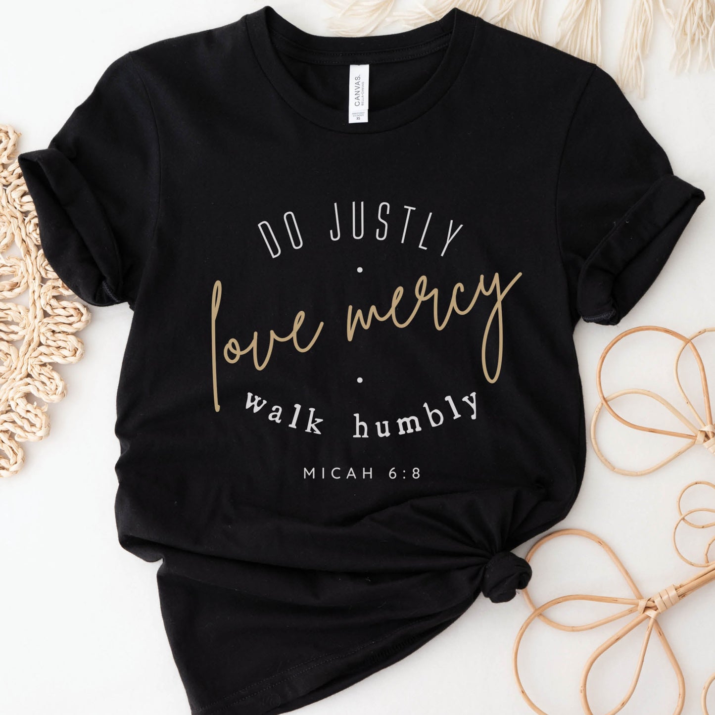 Women's Christian faith-based soft unisex t-shirt in black with Micah 6:8 bible verse scripture printed that says, "Do Justly, Love Mercy, Walk humbly, printed in gold and white, designed for women in sizes S thru 4X
