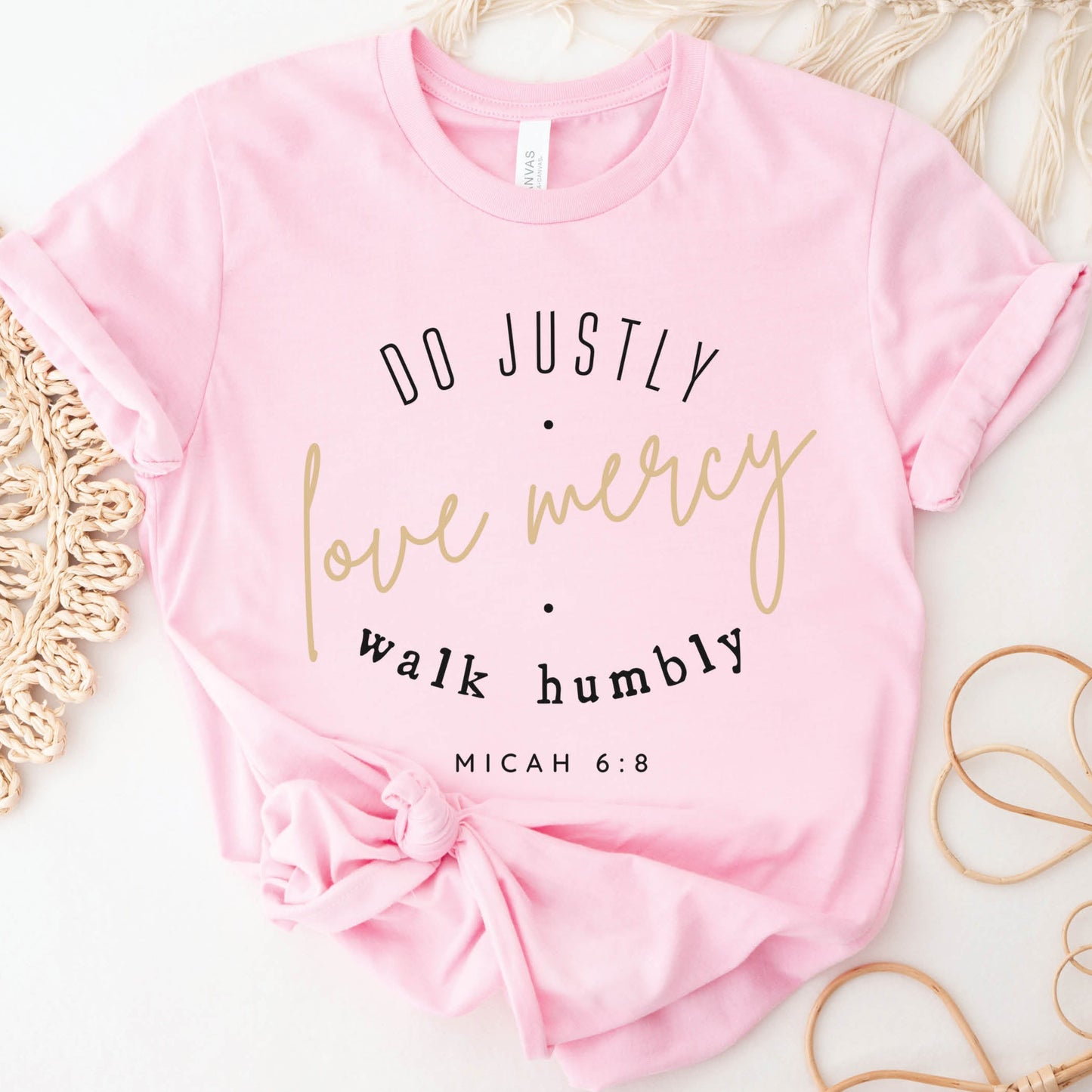 Pink Christian aesthetic faith-based unisex t-shirt for women with Micah 6:8 bible verse scripture printed that says, Do Justly Love Mercy walk humbly, in gold and black, unique gift for her