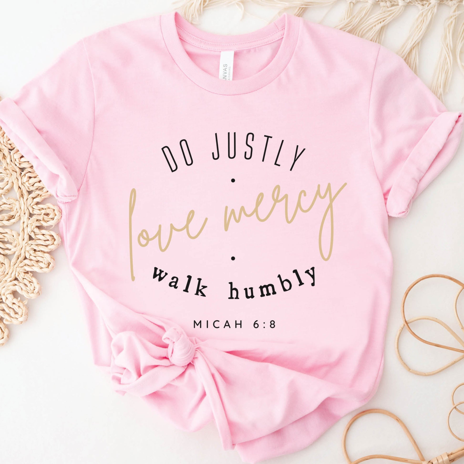 Pink Christian aesthetic faith-based unisex t-shirt for women with Micah 6:8 bible verse scripture printed that says, Do Justly Love Mercy walk humbly, in gold and black, unique gift for her