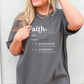 Young woman wearing a Faith Definition Hebrews 11:1 Christian aesthetic design printed in white on soft oversized asphalt gray unisex t-shirt for women and men