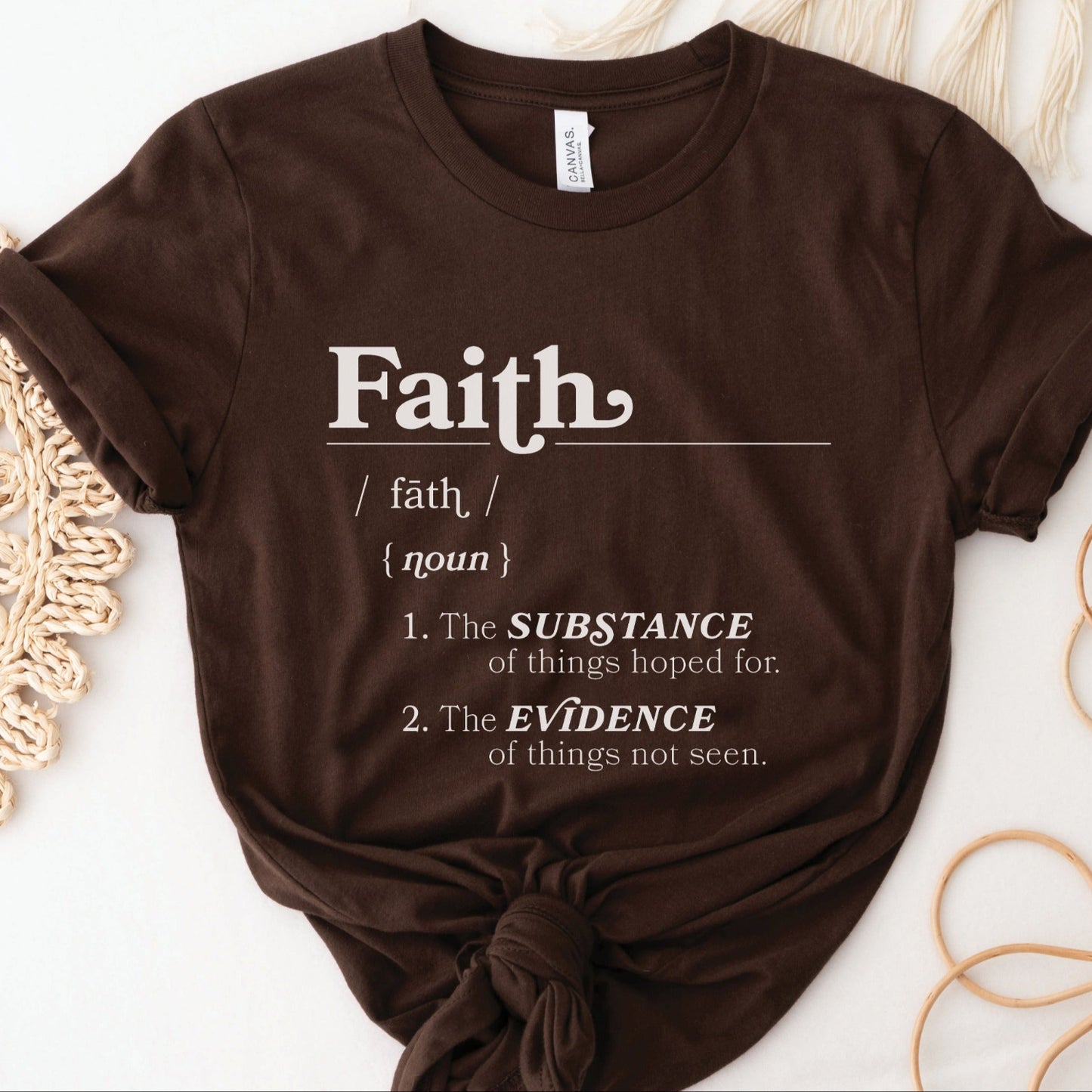 Faith Definition Hebrews 11:1 Christian aesthetic design printed in white on soft trendy brown unisex t-shirt for women and men