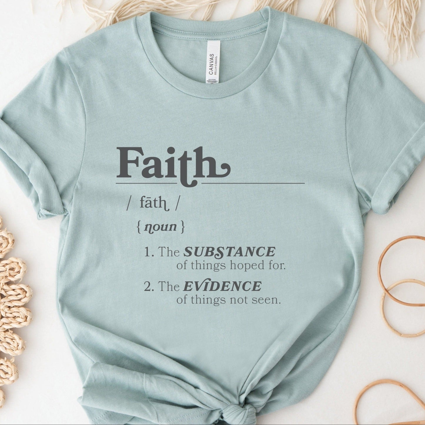 Faith Definition Hebrews 11:1 Christian aesthetic design printed in charcoal gray on soft heather dusty blue unisex t-shirt for women and men