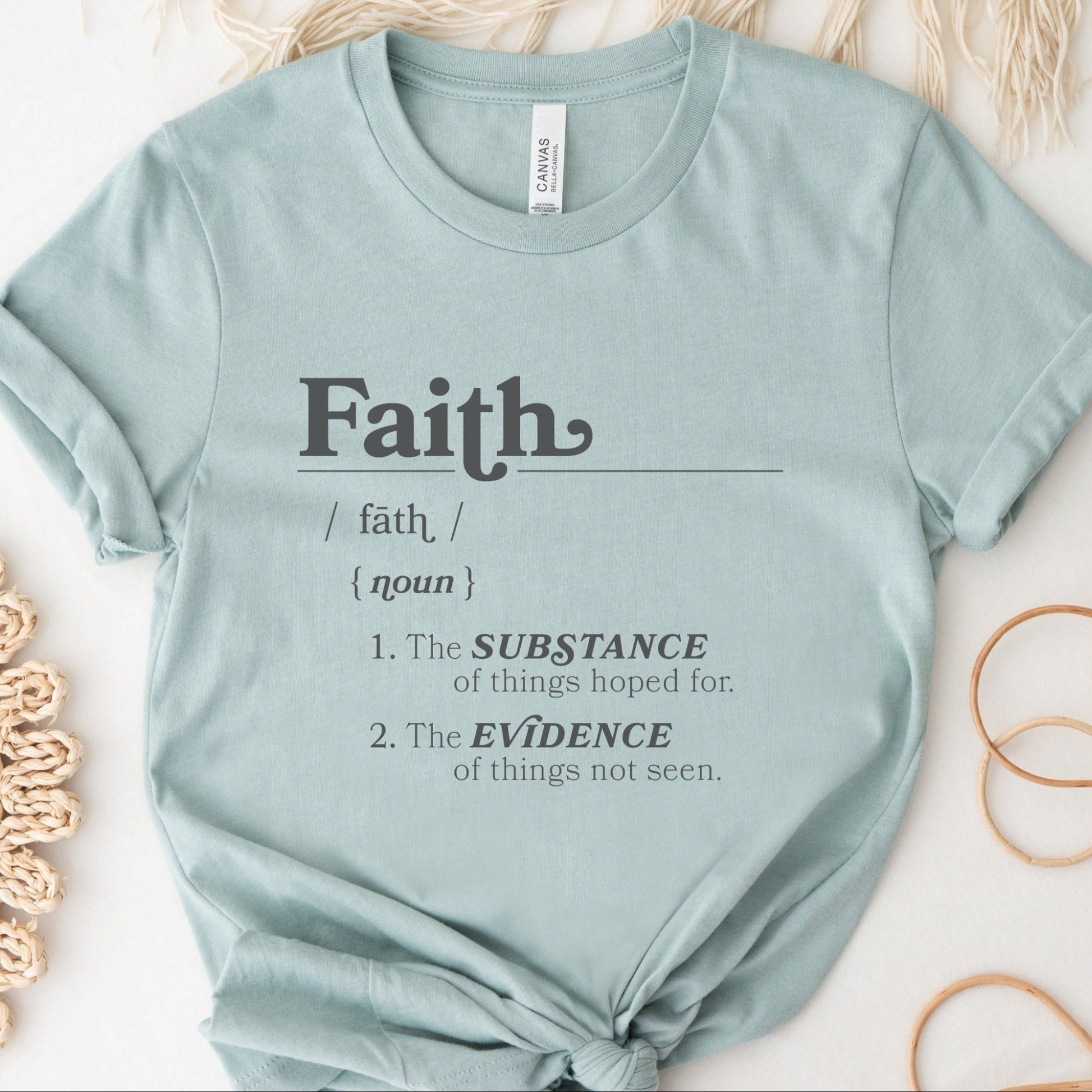 Faith Definition Hebrews 11:1 Christian aesthetic design printed in charcoal gray on soft heather dusty blue unisex t-shirt for women and men