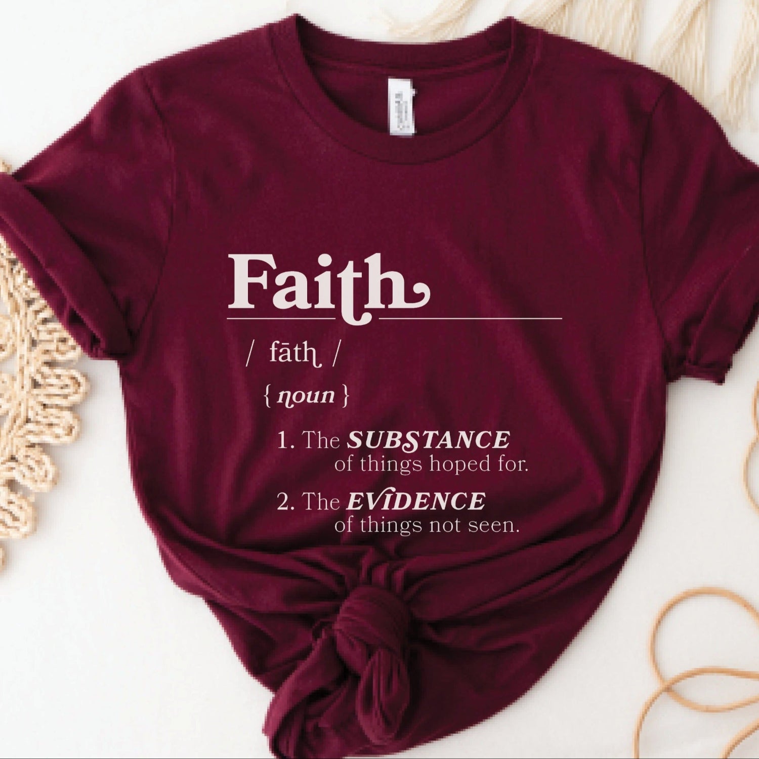 Faith Definition Hebrews 11:1 Christian aesthetic design printed in white on soft maroon burgundy unisex t-shirt for women and men