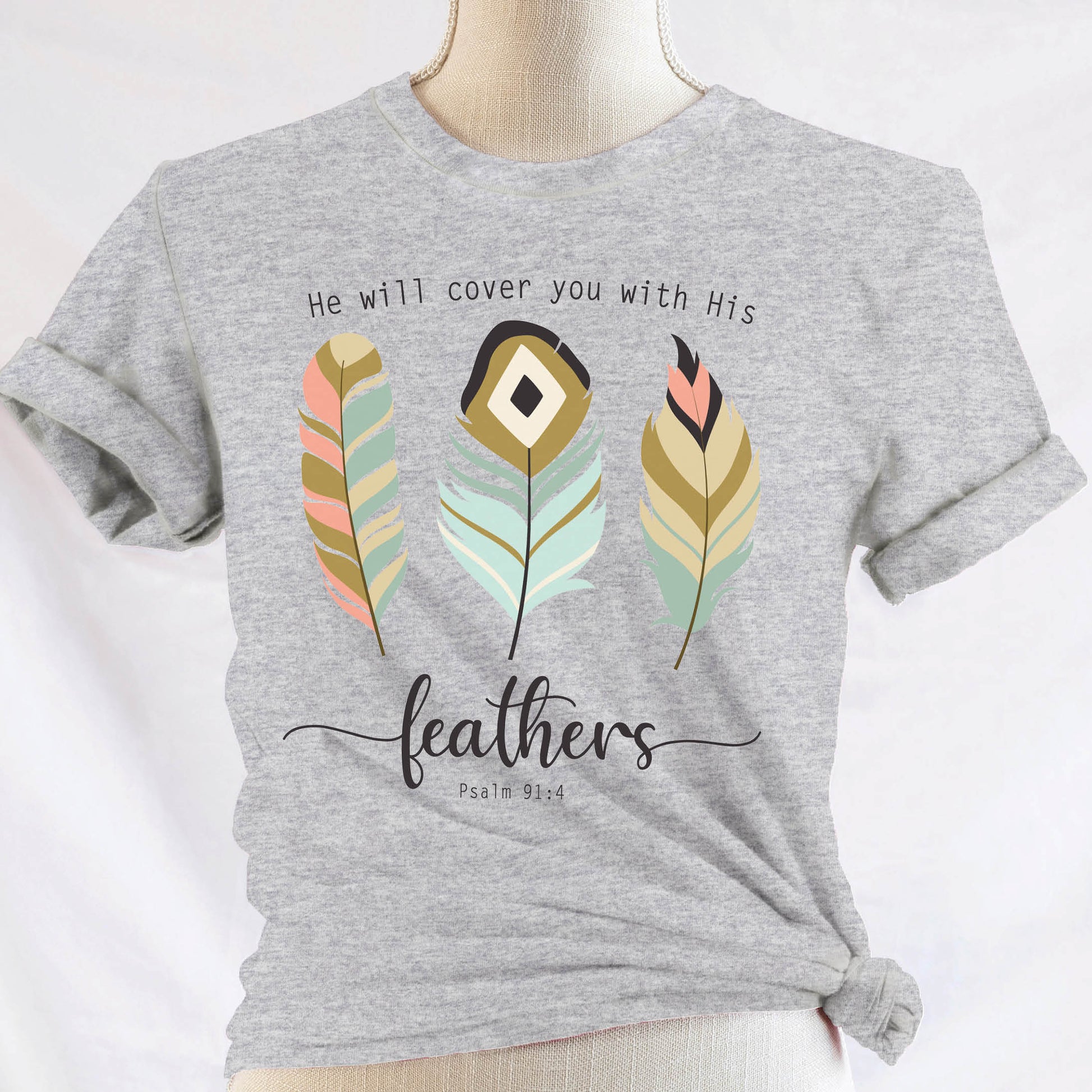 Psalm 91:4 "He Will Cover You With His Feathers" boho bible verse Christian woman aesthetic with teal peach and gold feathers printed on soft heather gray unisex t-shirt for women