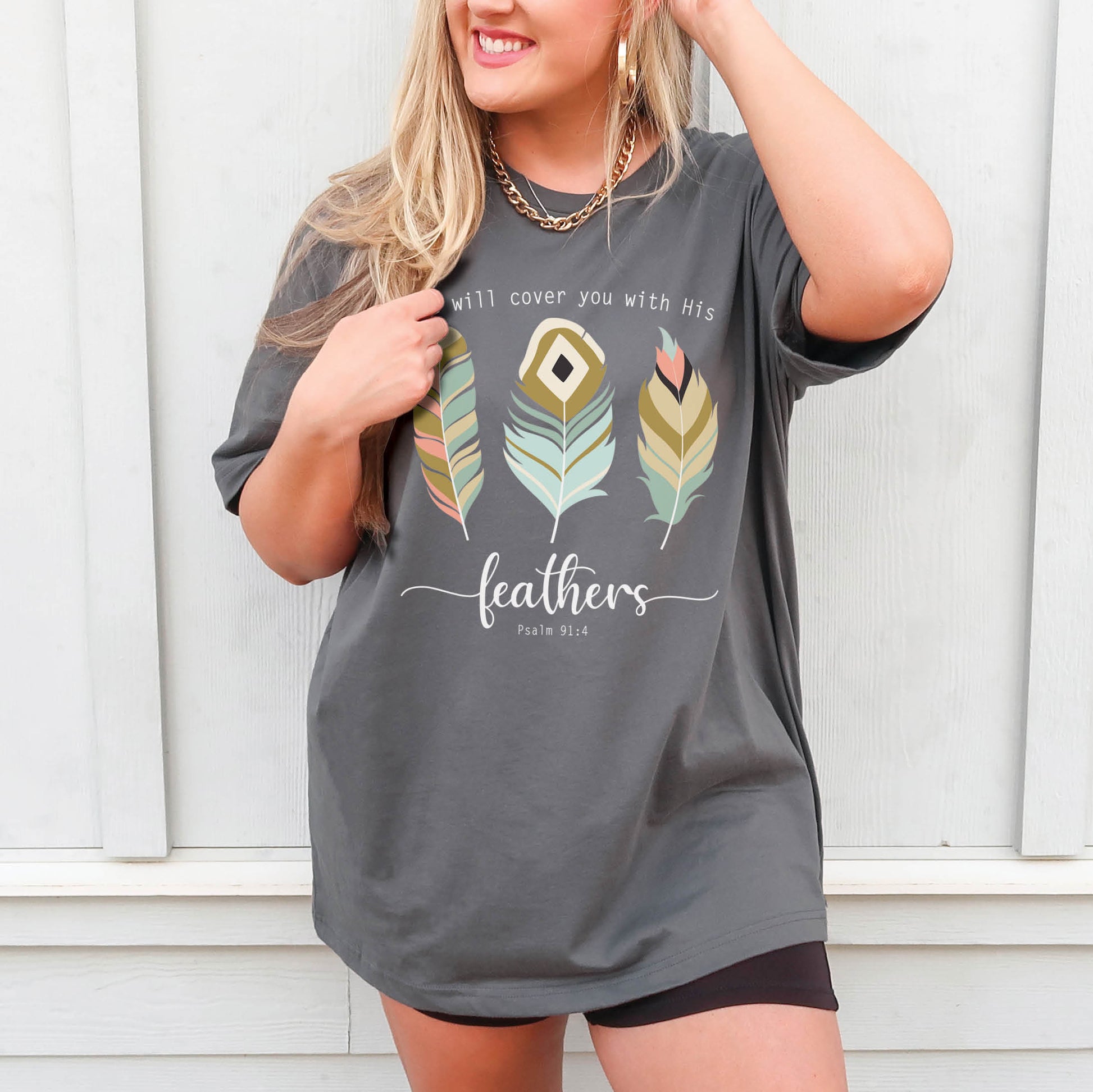 Psalm 91:4 "He Will Cover You With His Feathers" boho bible verse Christian woman aesthetic with teal peach and gold feathers printed on soft asphalt gray unisex t-shirt for women
