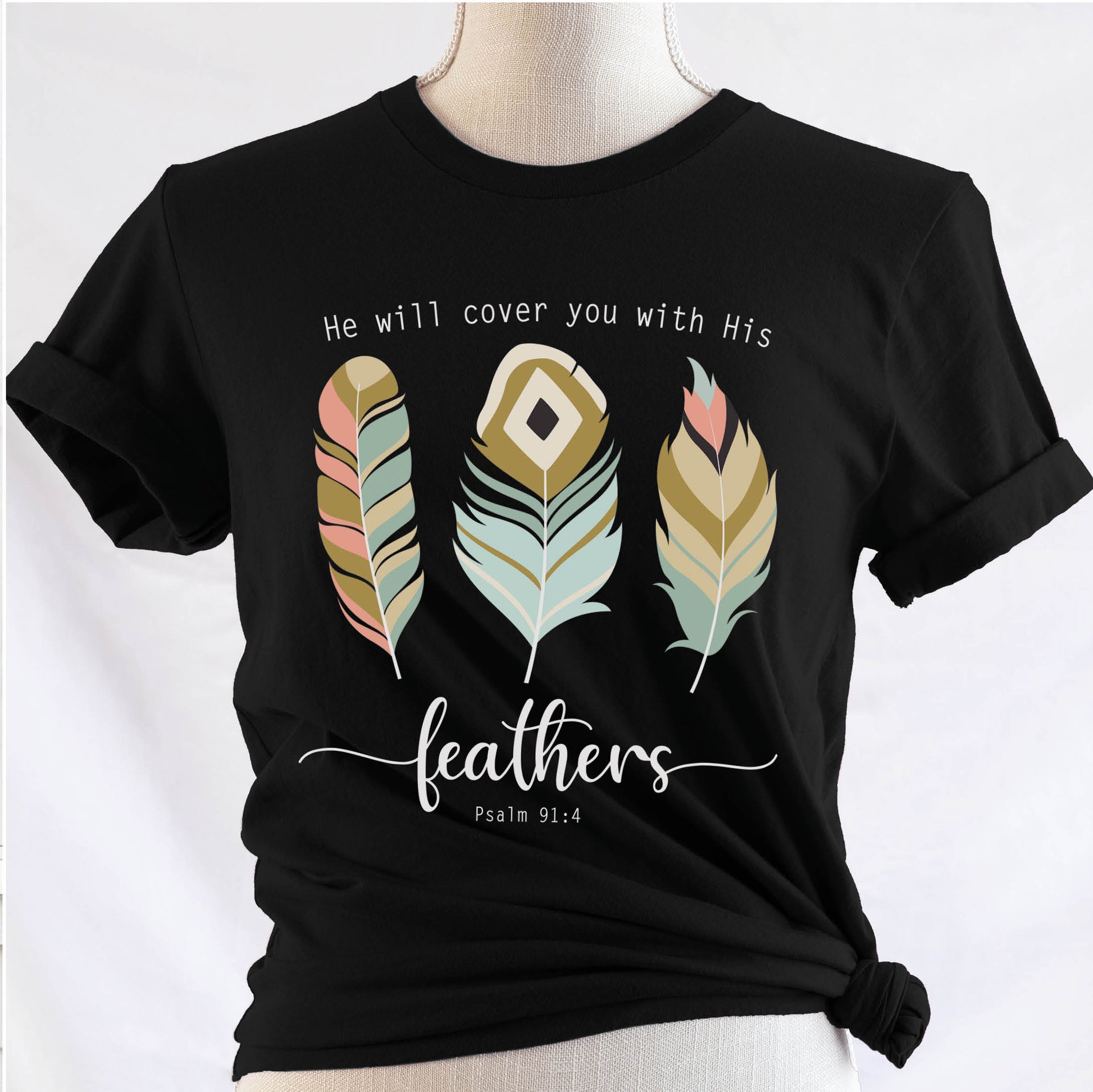 Psalm 91:4 "He Will Cover You With His Feathers" boho bible verse Christian woman aesthetic with teal peach and gold feathers printed on soft black unisex t-shirt for women