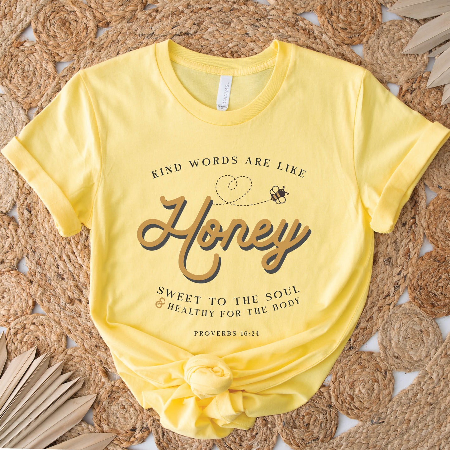 Yellow & gold Christian aesthetic unisex faith-based kindness bee t-shirt for women with Proverbs 16:24 bible verse quote that says, "Kind Words Are Like Honey, Sweet To the Soul, and Healthy For the Body" 