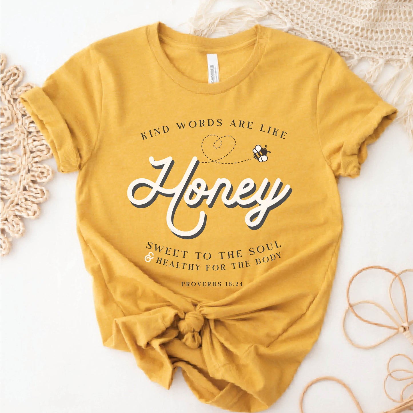 Mustard gold yellow Christian aesthetic unisex faith-based kindness t-shirt for women with Proverbs 16:24 bible verse quote that says, "Kind Words Are Like Honey, Sweet To the Soul, and Healthy For the Body" 