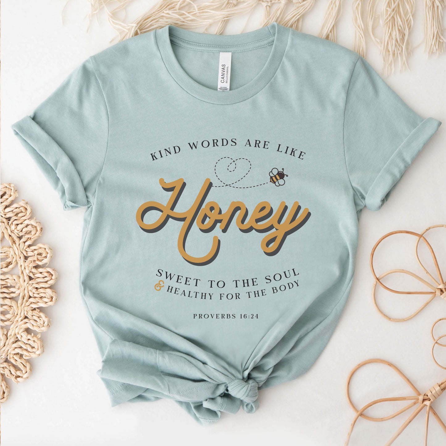 Dusty blue & gold Christian aesthetic unisex faith-based kindness bee t-shirt for women with Proverbs 16:24 bible verse quote that says, "Kind Words Are Like Honey, Sweet To the Soul, and Healthy For the Body" 