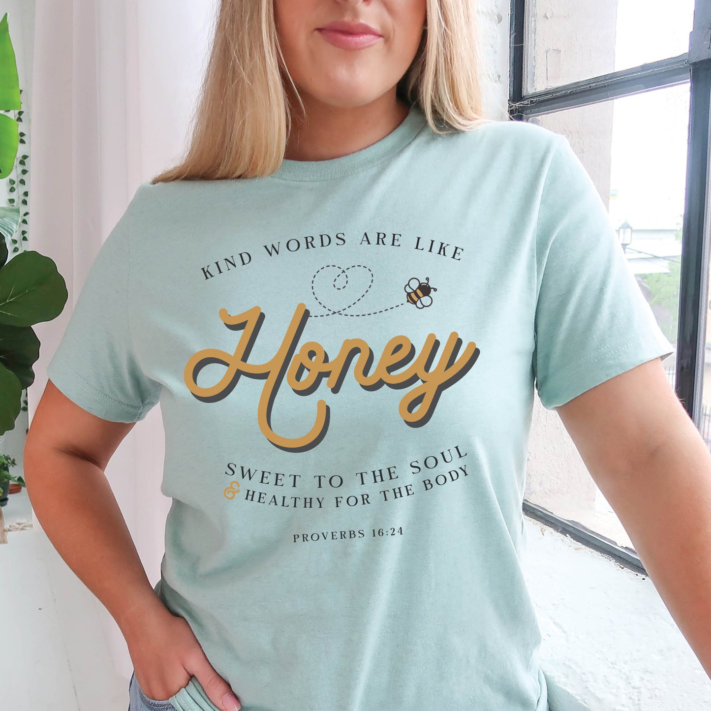 Dusty heather blue & gold Christian aesthetic unisex faith-based kindness bee t-shirt for women with Proverbs 16:24 bible verse quote that says, "Kind Words Are Like Honey, Sweet To the Soul, and Healthy For the Body" 