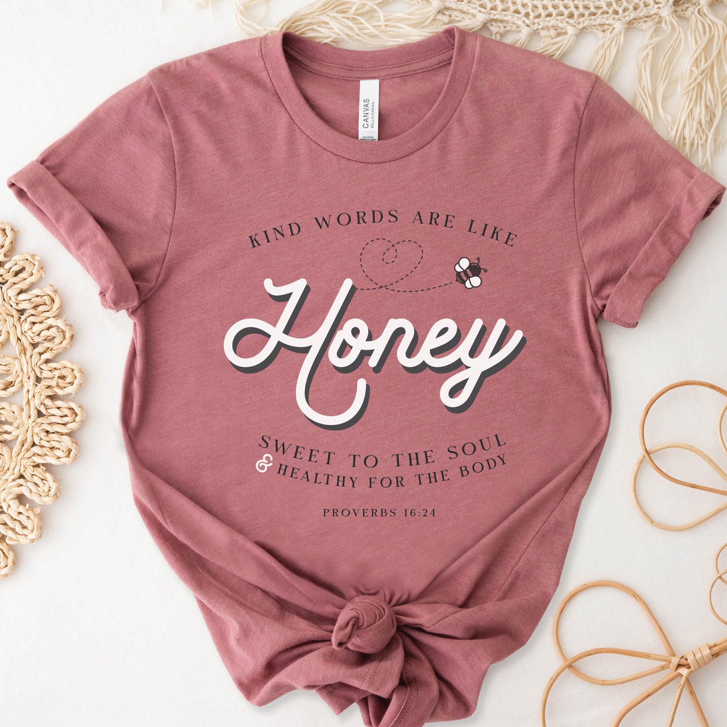 Mauve & gold Christian aesthetic unisex faith-based kindness bee t-shirt for women with Proverbs 16:24 bible verse quote that says, "Kind Words Are Like Honey, Sweet To the Soul, and Healthy For the Body" 