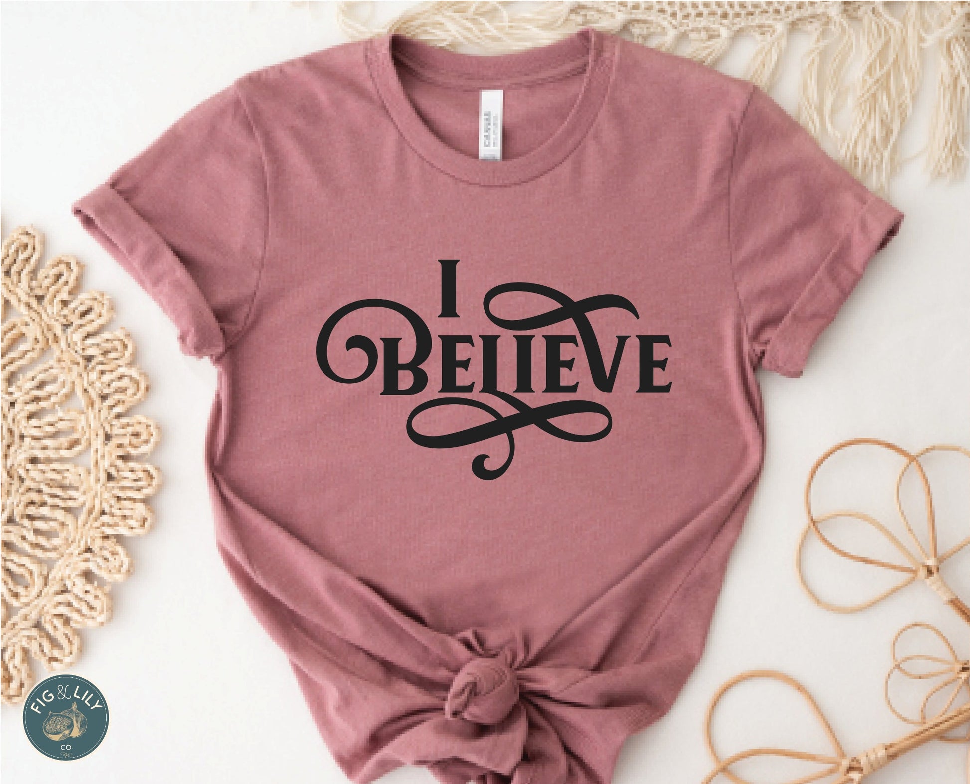 I Believe Swirl Christian aesthetic Jesus believer t-shirt design printed in black on soft mauve dusty rose tee for women, great gift for her