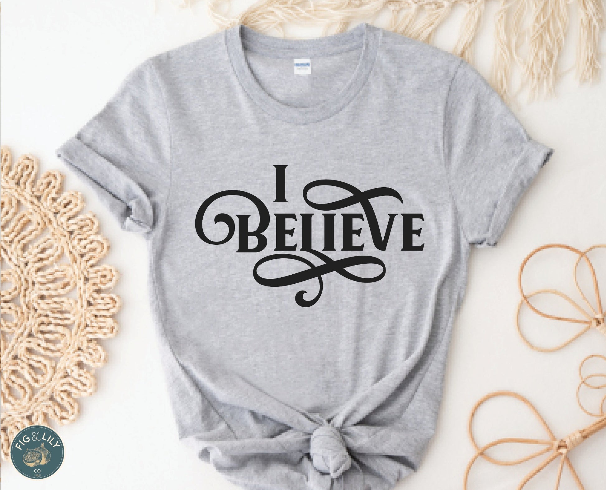 I Believe Swirl Christian aesthetic Jesus believer t-shirt design printed in black on soft heather gray tee for women, great gift for her