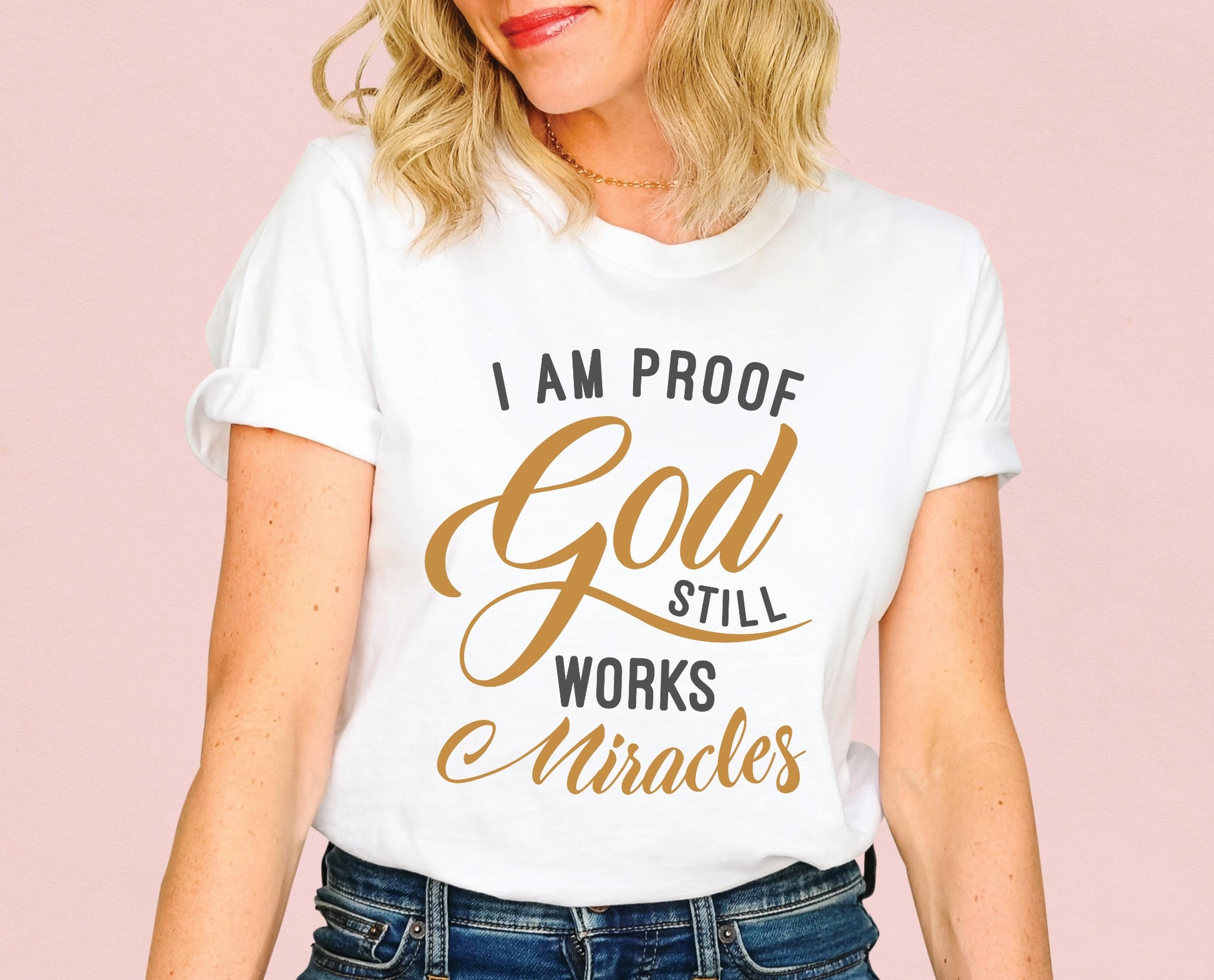 I am proof God still works miracles Christian aesthetic testimony design printed in charcoal and gold on white unisex t-shirt for women