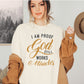 I am proof God still works miracles Christian aesthetic testimony design printed in charcoal and gold on soft cream unisex t-shirt for women