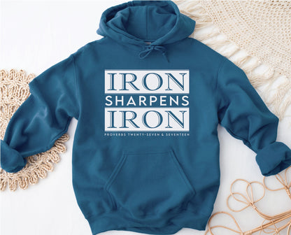 Iron Sharpens Iron Proverbs 27:17 Bible Verse Christian aesthetic faith-based hoodie with bold white design printed on cozy indigo blue unisex hoodie sweatshirt for men and women