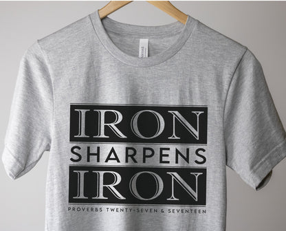 Iron Sharpens Iron Proverbs 27:17 Christian aesthetic block style design printed in black on soft heather gray unisex t-shirt for men's groups