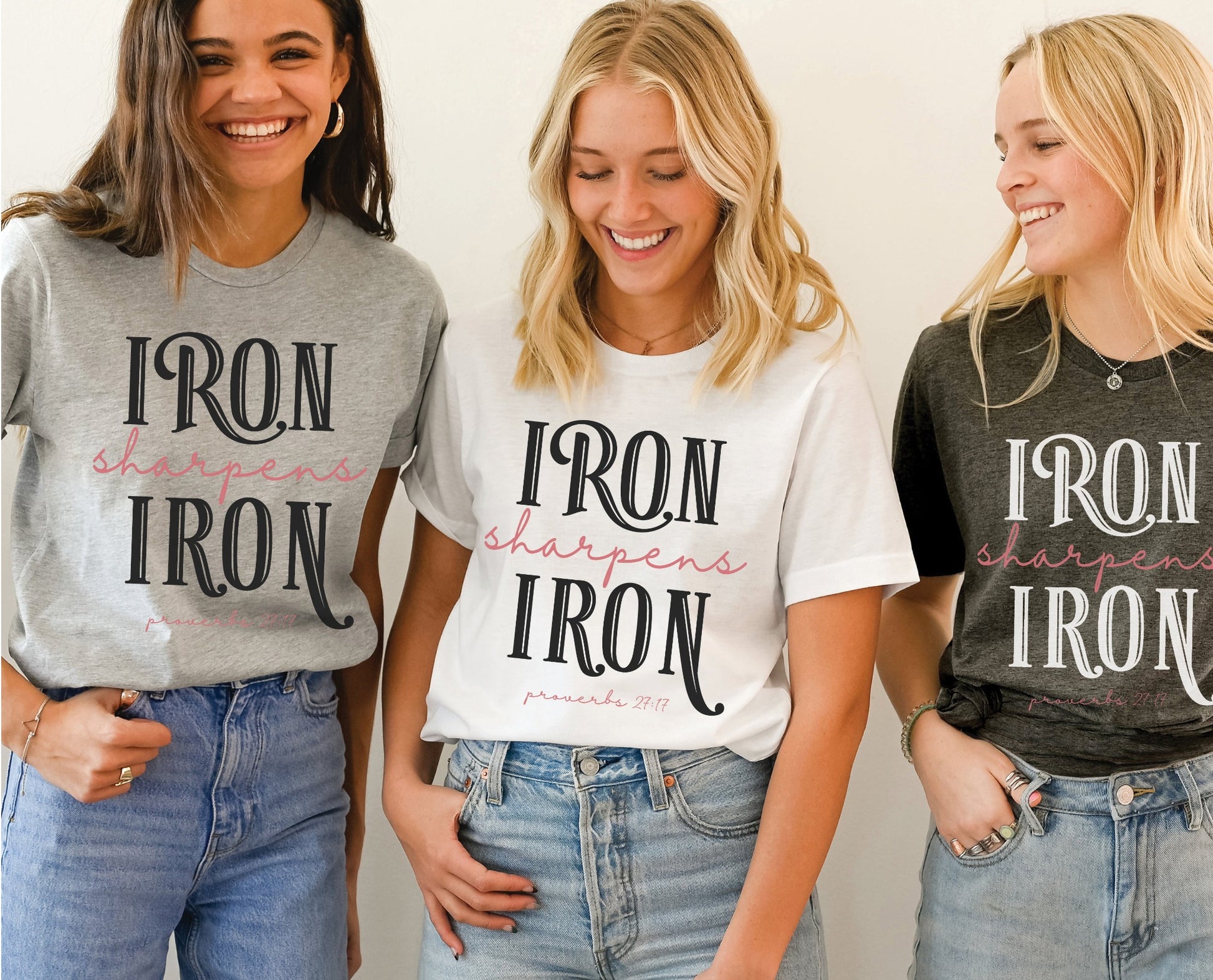 Iron Sharpens Iron Proverbs 27:17 Christian aesthetic design printed in black, white, and mauve on ladies soft unisex t-shirts for women's groups
