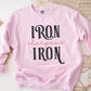 Iron Sharpens Iron Proverbs 27:17 Christian aesthetic design printed in black and mauve on cozy light pink unisex crewneck sweatshirt for women's groups