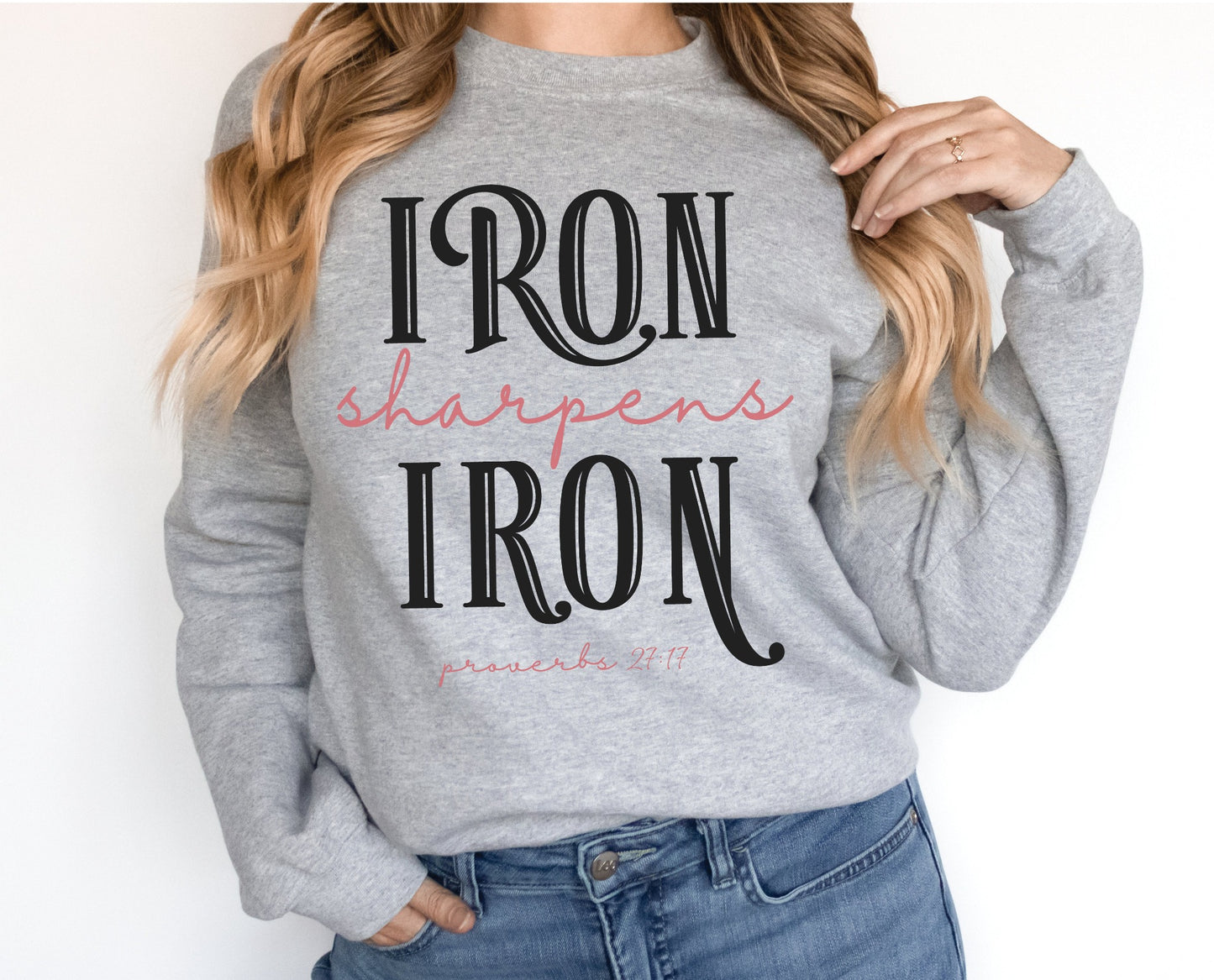 Iron Sharpens Iron Proverbs 27:17 Christian aesthetic design printed in black and mauve on cozy heather gray unisex crewneck sweatshirt for women's groups