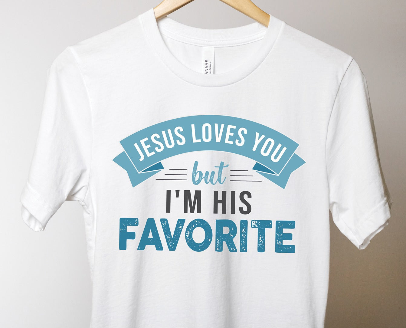 Jesus Loves You But I'm His Favorite funny religious Christian aesthetic adult size t-shirt printed in teal on soft white unisex tee for women & men