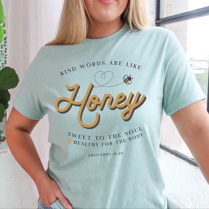 Dusty heather blue & gold Christian aesthetic unisex faith-based kindness bee t-shirt for women with Proverbs 16:24 bible verse quote that says, "Kind Words Are Like Honey, Sweet To the Soul, and Healthy For the Body" 