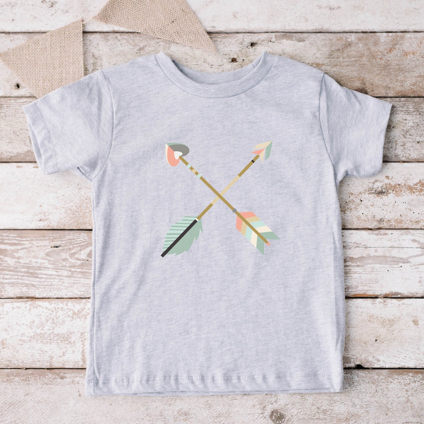 Heather gray toddler size t-shirt with pastel criss-cross boho arrows, one with a heart on the end, to match Christian mom's womens' "Raising Arrows" Psalm 127:4-5 bible verse t-shirt for boys and girls