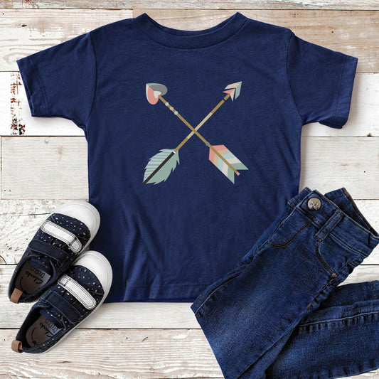 Navy blue toddler size t-shirt with teal blue and dusty pink pastel criss-cross boho arrows, one with a heart on the end, matching mommy-and-me Christian Mom "Raising Arrows" Psalm 127:4-5 bible verse t-shirt for boys and girls